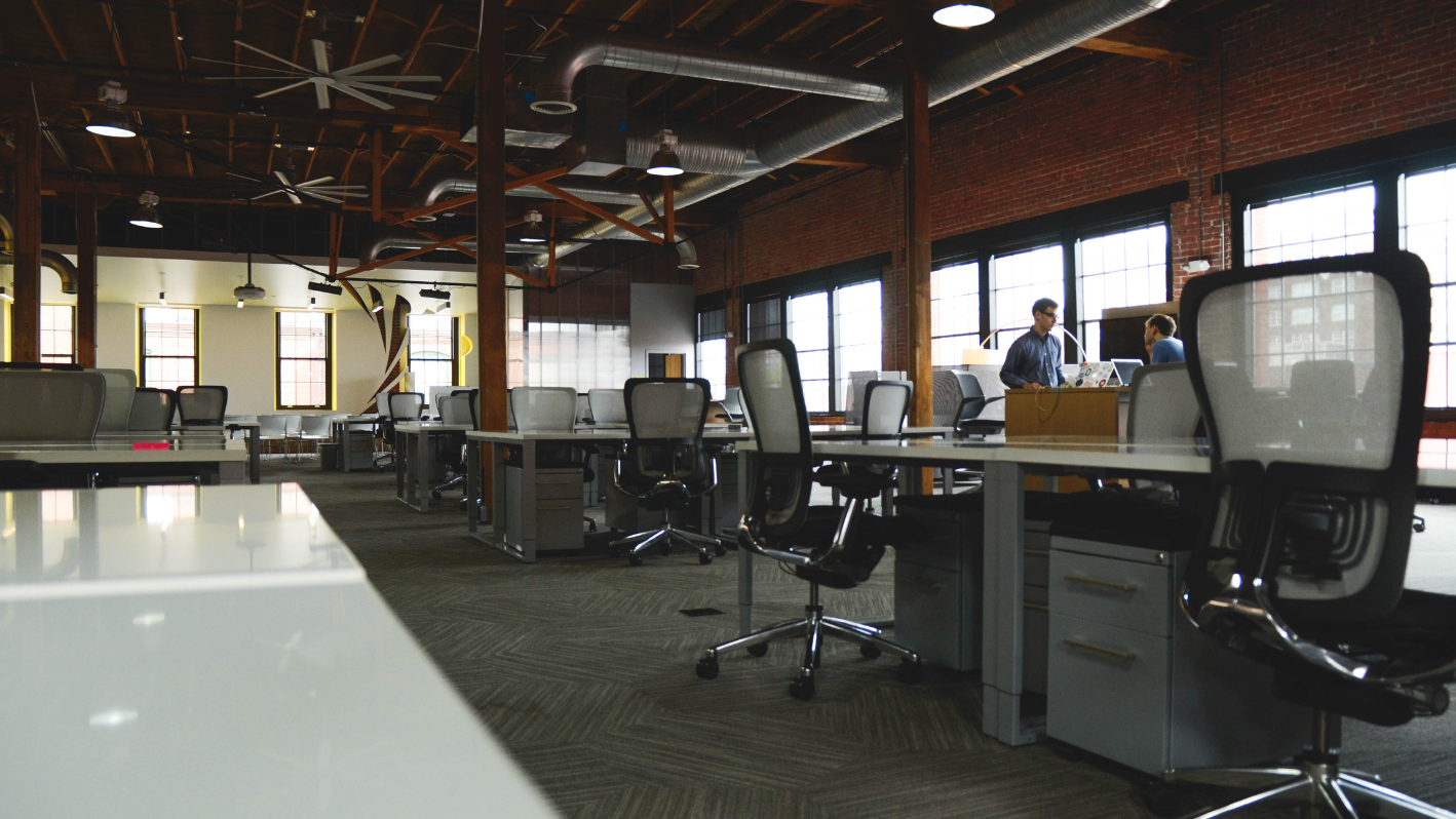 An office with a long table and chairs