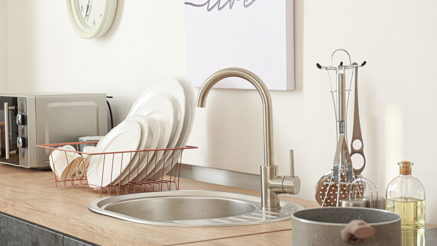 A kitchen counter with a bunch of dishes on it